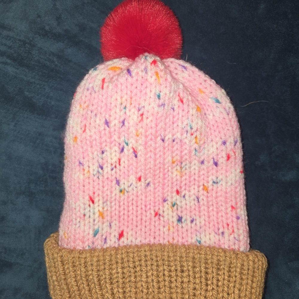Playful Pink Knit Beanie with Red Pom Pom